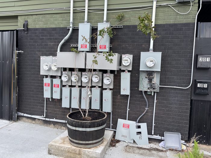 Large multi-unit meter bank installed by TK Electric for an apartment complex