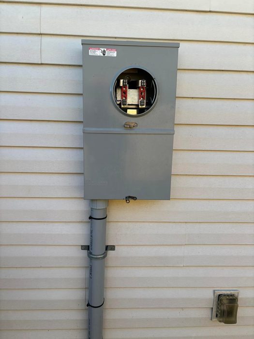 New electric meter can installed on siding by TK Electric in New Orleans, LA