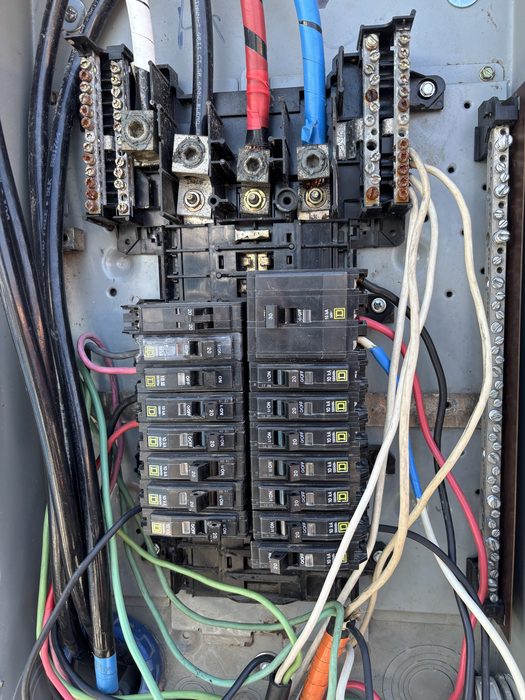 Panel rewiring closeup showing new breakers and bus bars by TK Electric